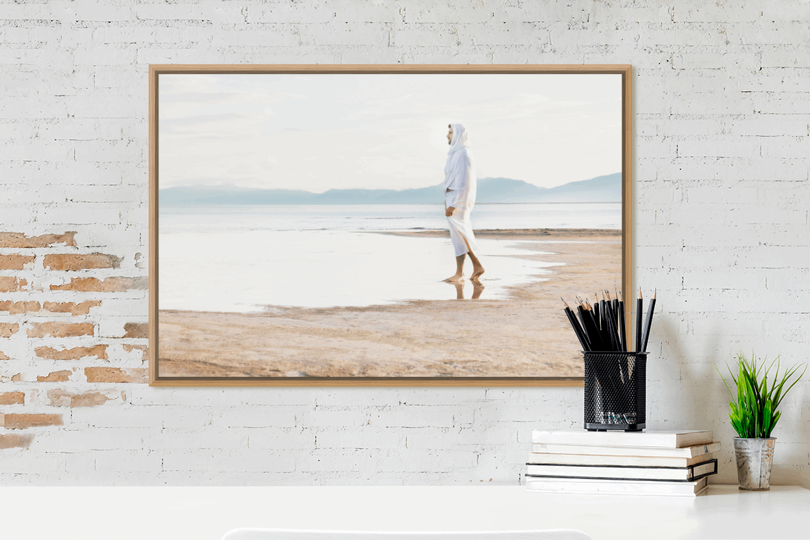 Christ on the seashore, calming still water and grey, blue, sandy neutral hues. Serene landscape of the contemplative Christ bringing calm to any room. A beautiful portrait of the Savior by H. Walker Photoart. The Prince of Our Peace is the perfect addition to any room. Religious Art.
